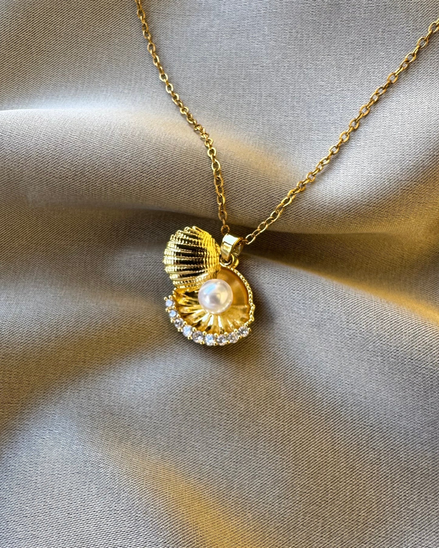 Pearl in shell necklace