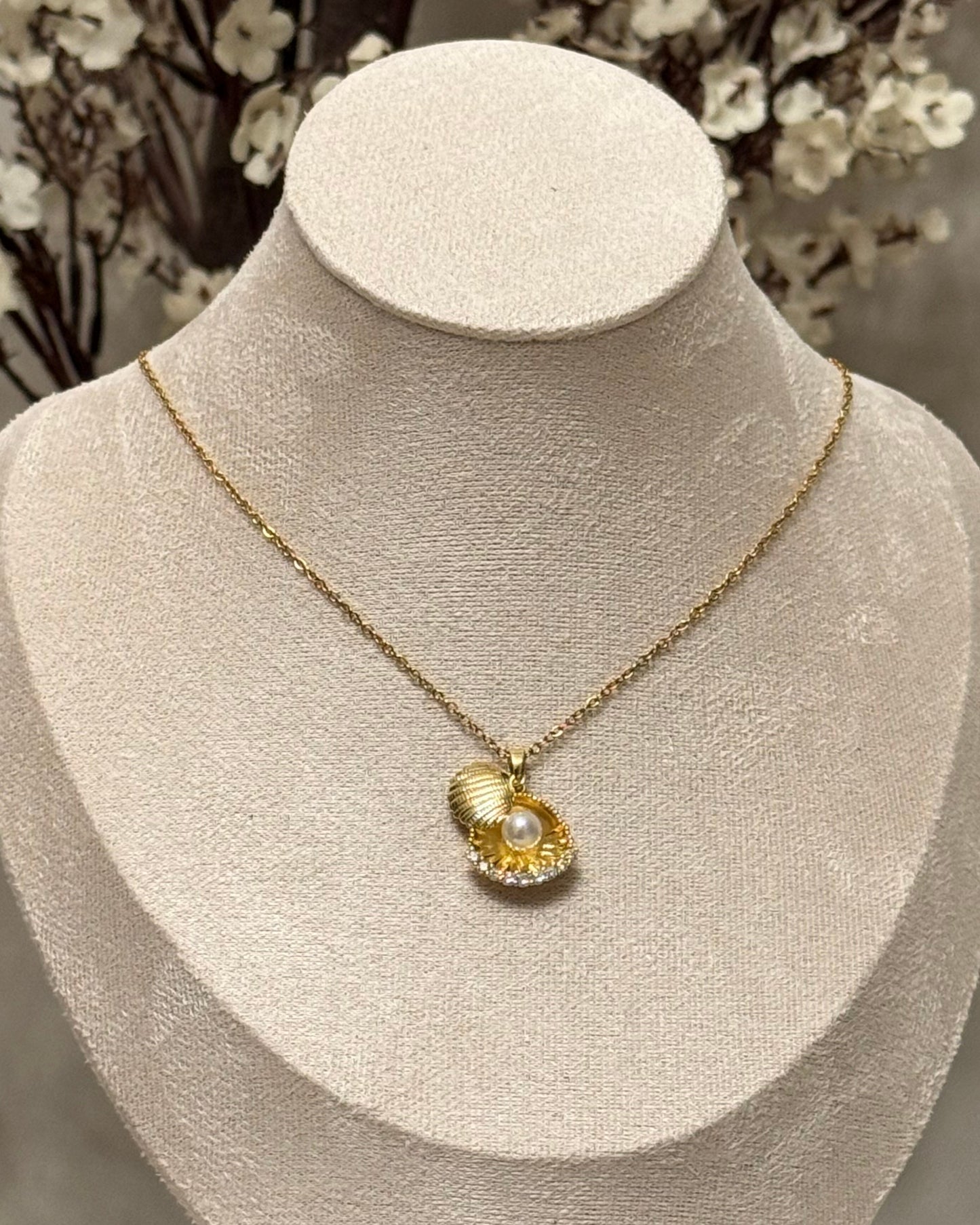 Pearl in shell necklace